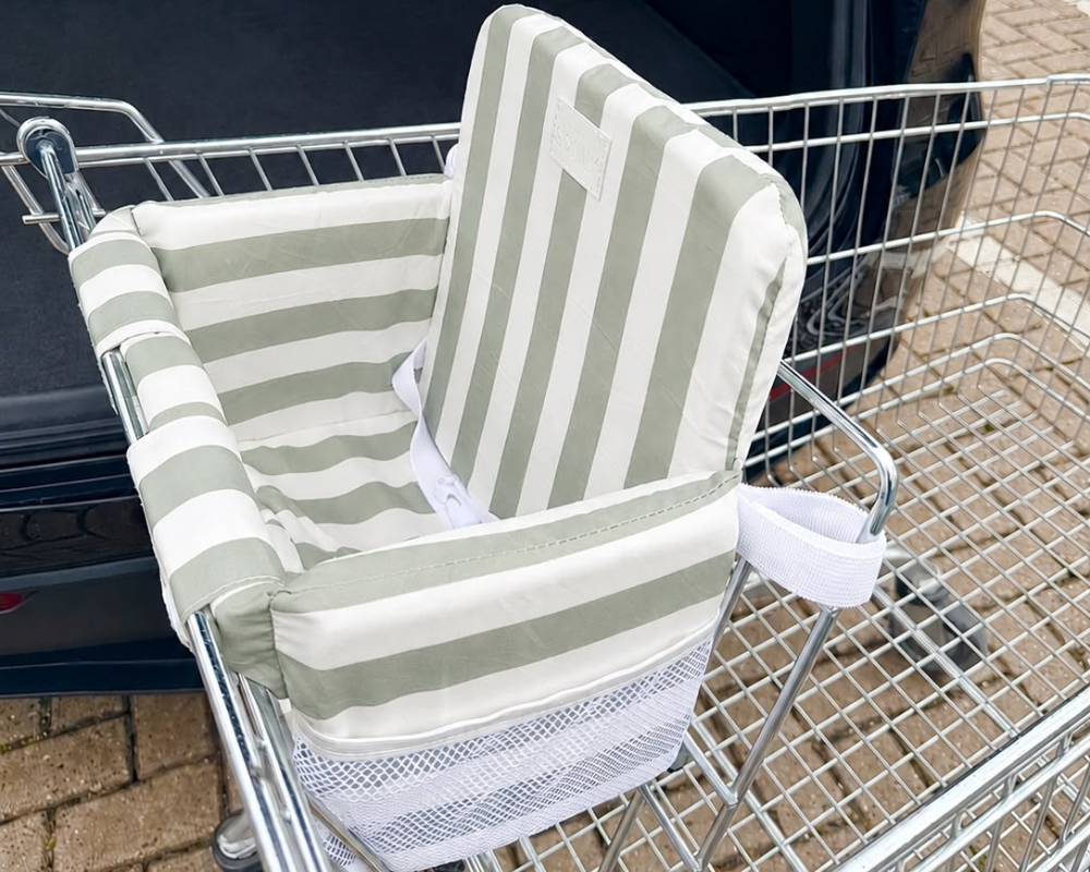Little Sonny Seat insert in a supermarket trolley, sage and white stripe